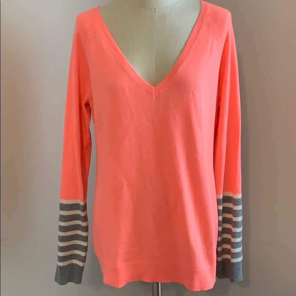 Neon orange sweater with striped sequin sleeves